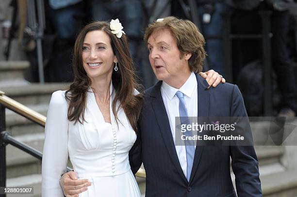 Nancy Shevell and Sir Paul McCartney depart Marylebone Registry Office after their civil ceremony marriage on October 9, 2011 in London, England.