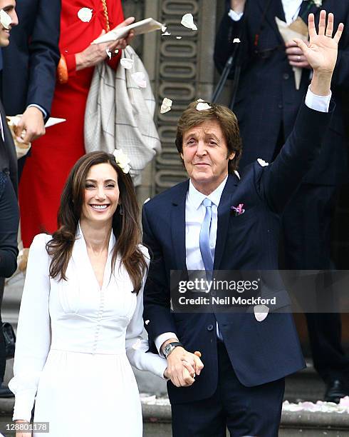 Sir Paul McCartney and Nancy Shevell seen leaving Marylebone Registry Office after their wedding on October 9, 2011 in London, England.