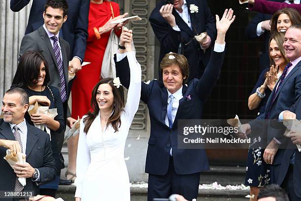 Sir Paul McCartney and Nancy Shevell seen leaving Marylebone Registry Office after their wedding on October 9, 2011 in London, England.