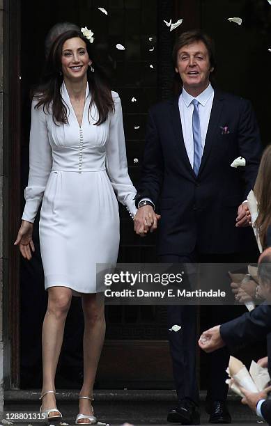 Sir Paul McCartney and Nancy Shevell leave the Marylebone Registry Office after their civil ceremony marriage on October 9, 2011 in London, England.