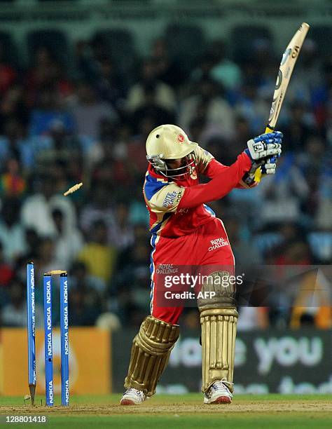 Batsman Tillakaratne Dilshan being bowled out by Mumbai Indian's bowler Lasith Malinga during the Champions League Twenty20 final match between Royal...