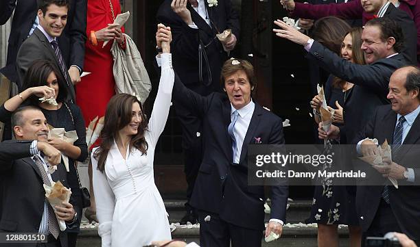 Sir Paul McCartney and Nancy Shevell after their wedding at Marylebone Registry Office on October 9, 2011 in London, England.