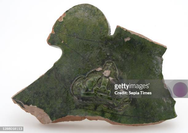 Green fragment of earthenware fire dome with crown in relief, firecock fireplaces earthenware ceramic pottery clay engobe glaze lead glaze lb 14.5,...