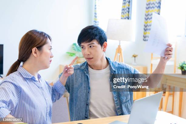 couple discuss finances at home - couple counting money stock pictures, royalty-free photos & images