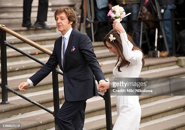 Sir Paul McCartney and Nancy Shevell arrive at the Marylebone Registry Office for their civil ceremony marriage on October 9, 2011 in London, England.
