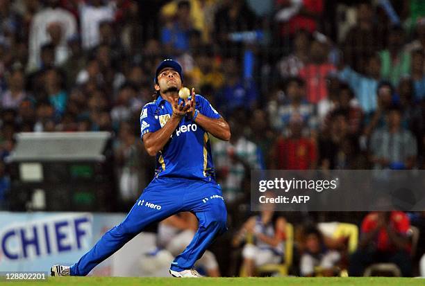 Mumbai Indians fielder Sarul Kanwar dismisses RCB batsman Mohammed Kaif by taking a catch during the Champions League Twenty20 final match between...