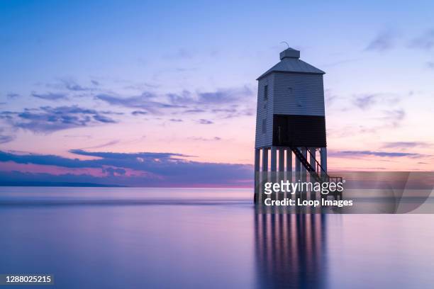The Low Lighthouse on the beach at Burnham-on-Sea overlooking Bridgwater Bay at dusk.