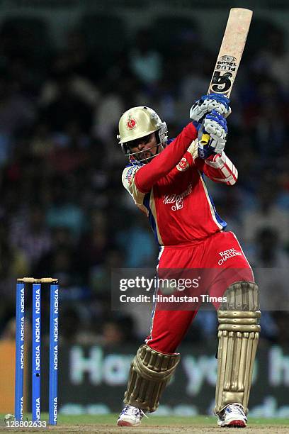 Royal Challengers Bangalore batsman Tilakratne Dilshan hits the ball during the Champions League Twenty20 Final match between Mumbai Indians and...