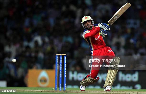 Royal Challengers Bangalore batsman Tilakratne Dilshan hits the ball during the Champions League Twenty20 Final match between Mumbai Indians and...