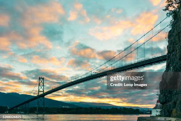 View of sunrise from under Lions Gate Bridge in Vancouver in Canada.