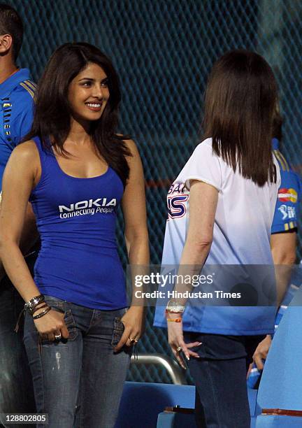 Mumbai Indians owner Nita Ambani and Bollywood actress Priyanka Chopra attend the Champions League Twenty20 Final match between Mumbai Indians and...