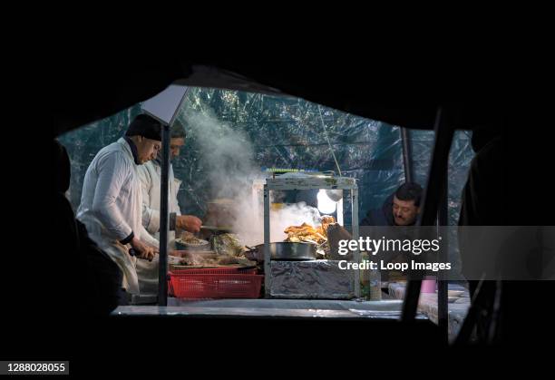 Street market and food stalls in Jemaa el-Fna square in Marrakesh in Morocco.