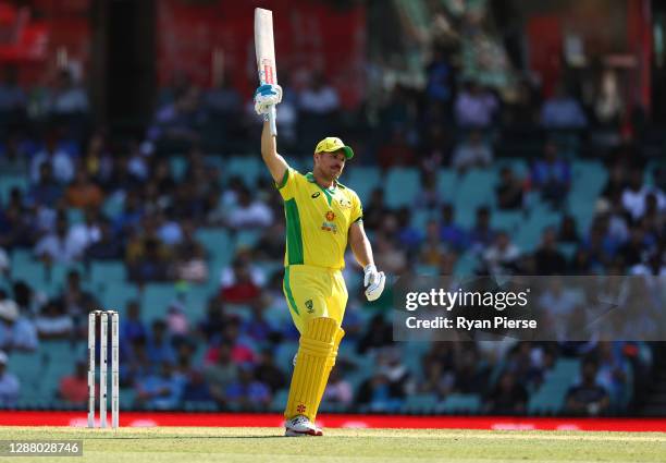 Aaron Finch of Australia celebrates after reaching his half century during game one of the One Day International series between Australia and India...