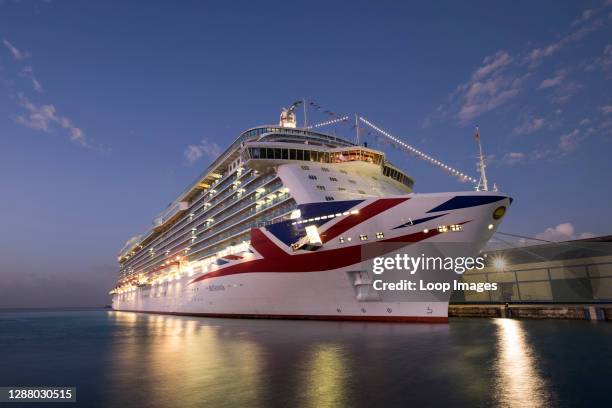 Cruise ship Britannia in Bridgetown Harbour at night.