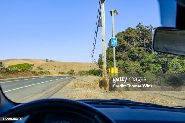 car stopped at a call box - emergency telephone box stock pictures, royalty-free photos & images