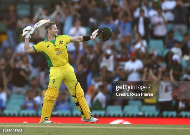 Steve Smith of Australia celebrates after reaching his century during game one of the One Day International series between Australia and India at...