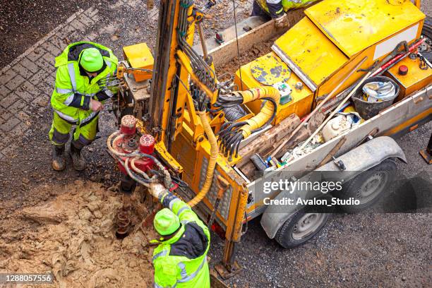 surveyor examines the ground by drilling - borehole stock pictures, royalty-free photos & images