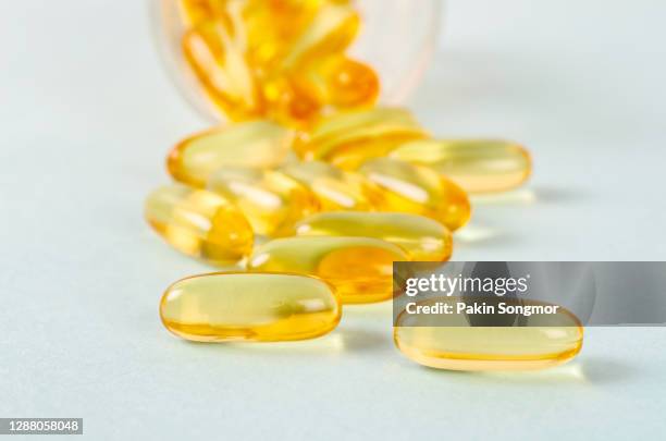 fish oil capsules on white background, healthy diet concept. - fish oil ストックフォトと画像