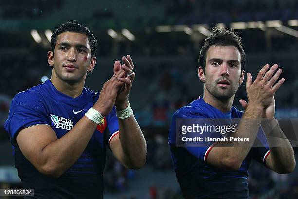 Maxime Mermoz and Morgan Parra of France celebrate victory after quarter final two of the 2011 IRB Rugby World Cup between England and France at Eden...