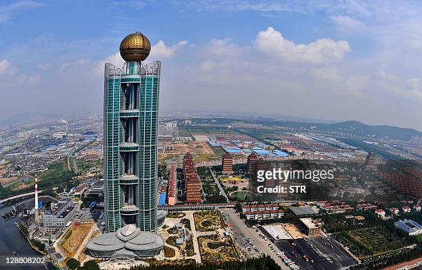 This aerial photo taken on September 25 shows the Longxi International Hotel, standing at 328 metres high and costing 470 million USD to build, in...