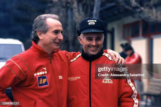 Azelio Vicini head coach of Italy embraces Arrigo Sacchi head coach of AC Milan before the training session at Centro Sportivo di Milanello in Milan...