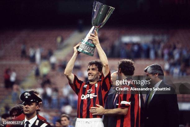 Roberto Donadoni of AC Milan lifts the trophy after the 1994 Supercoppa Italiana match between AC Milan and Sampdoria at Stadio Giuseppe Meazza on...