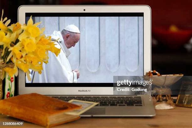 Coronavirus epidemic . Lockdown. Easter 2020. Webcast of the Vatican Resurrection Mass on laptop. Pope Francis. France.