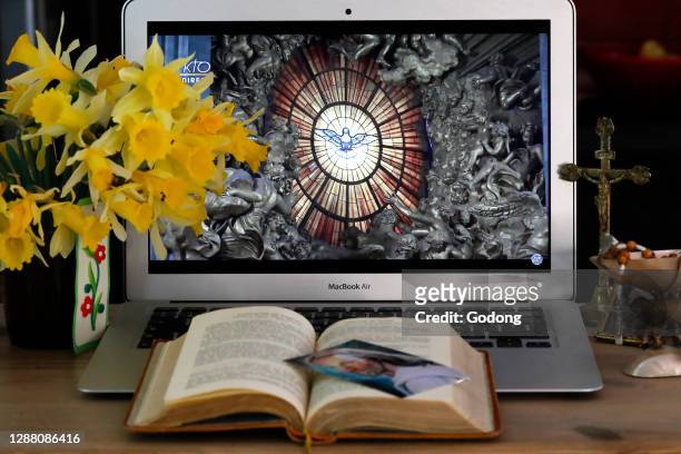 Coronavirus epidemic . Lockdown. Easter 2020. Webcast of the Vatican Resurrection Mass on laptop. France.