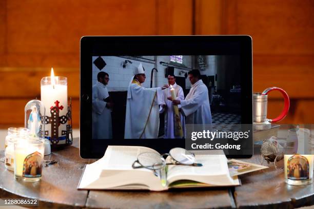 Coronavirus epidemic . Altar at home. Holy Week. Broadcast of the Easter vigil on Youtube. France.