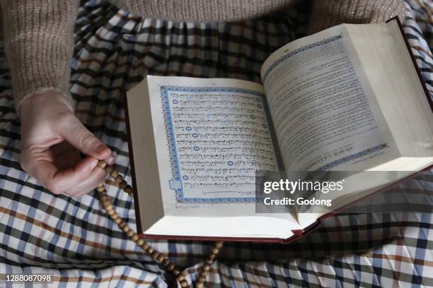Kahina Bahloul, the first woman imam in France, reading the kuran in Paris.