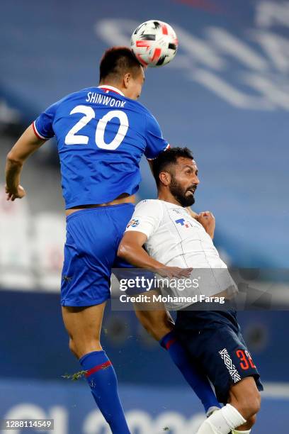 Joan Oumari of FC Tokyo and Kim Shinwook of Shanghai Shenhua compete for the ball during the AFC Champions League Group F match between Shanghai...