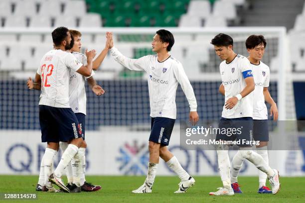 Tokyo's players celebrate their win during the AFC Champions League Group F match between Shanghai Shenhua and FC Tokyo at the Education City Stadium...
