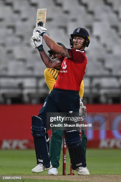 Ben Stokes of England hits out as wicketkeeper Quinton de Kock of South Africa looks on during the 1st Twenty20 International between South Africa...