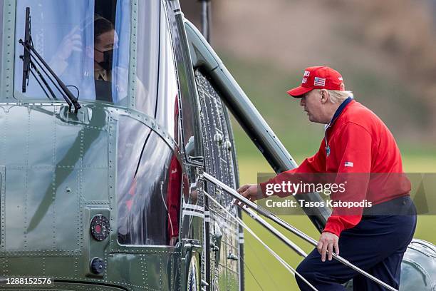 President Donald Trump walks to Marine One at Trump National Golf Club on November 27, 2020 in Sterling, Virginia. President Trump heads to Camp...