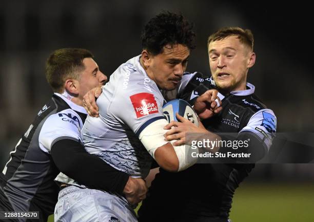 Falcons players Ben Stevenson and Brett Connon combine to tackle Sale wing Denny Solomona during the Gallagher Premiership Rugby match between...