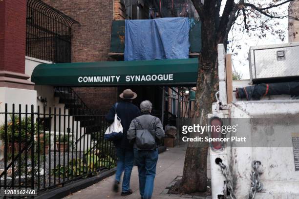 People walk by a synagogue on November 27, 2020 in New York City. In a decision which included newly installed Justice Amy Coney Barrett, the Supreme...