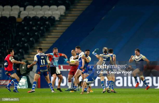 St Helens players celebrate victory on the final play during the Betfred Super League Grand Final between Wigan Warriors and St Helens at KCOM...