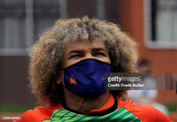 Carlos Valderrama known as 'El Pibe' former football player and captain of the Colombian national team looks on during the re-inauguration of the...