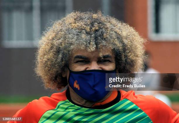 Carlos Valderrama known as 'El Pibe' former football player and captain of the Colombian national team looks on during the re-inauguration of the...