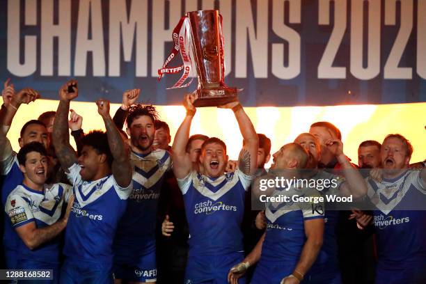 Morgan Knowles of St Helens lifts the trophy to celebrate with his team mates following their sides' victory during the Betfred Super League Grand...