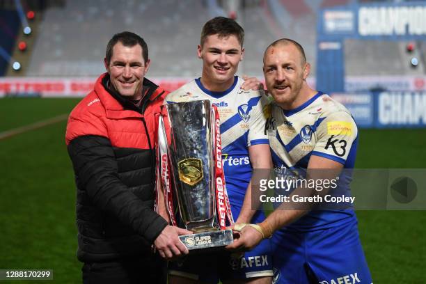 Kristian Woolf, Head Coach of St Helens , try-scorer Jack Welsby and James Roby of St Helens pose with the trophy following victory during the...
