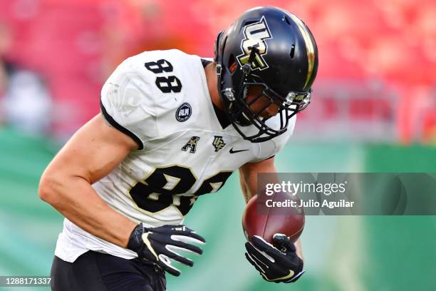 Jake Hescock of the UCF Knights catches a 1-yard touchdown during the first quarter against the South Florida Bulls at Raymond James Stadium on...