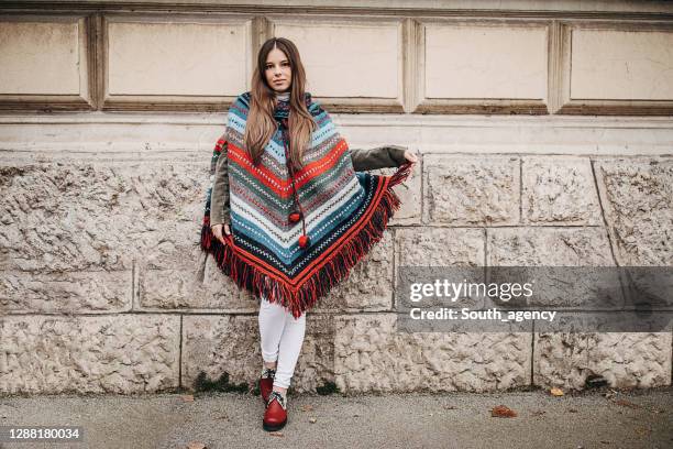 fashionable modern woman on the street - poncho imagens e fotografias de stock