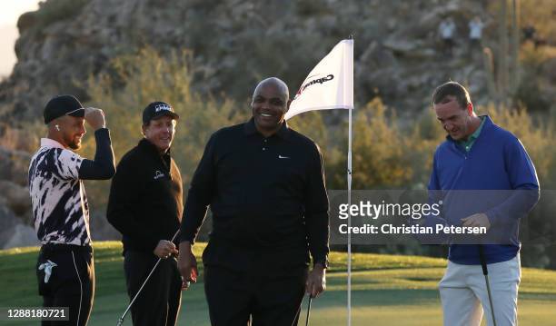 Phil Mickelson and Charles Barkley celebrate defeating Stephen Curry and Peyton Manning 4&3 on the 15th green during Capital One's The Match:...
