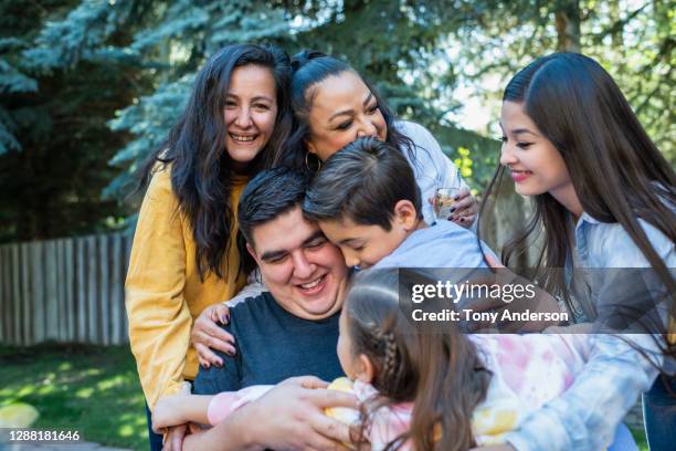 family gathered together in back yard - innocence stock pictures, royalty-free photos & images