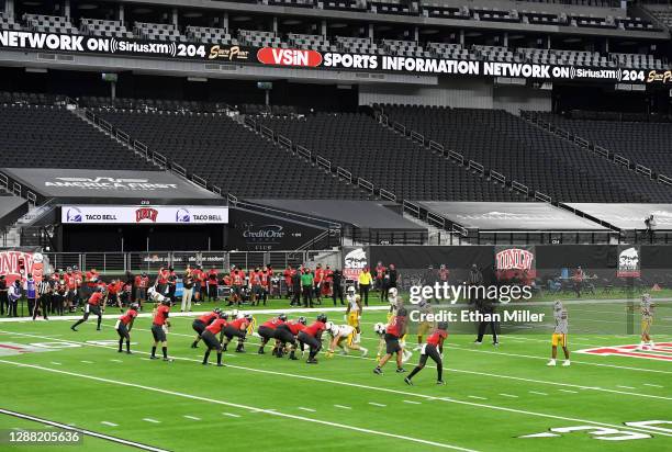 The Wyoming Cowboys and the UNLV Rebels play without fans in the stands in the first half of their game at Allegiant Stadium on November 27, 2020 in...