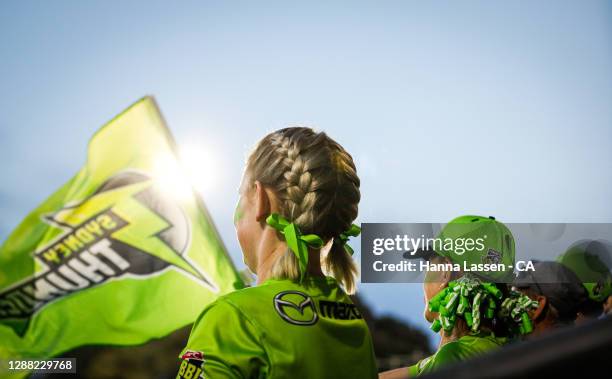 Fans react during the Women's Big Bash League Final between the Melbourne Stars and the Sydney Thunder at North Sydney Oval, on November 28 in...