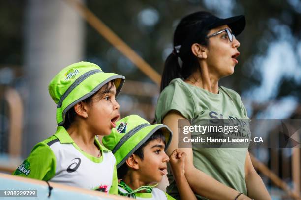 Fans react during the Women's Big Bash League Final between the Melbourne Stars and the Sydney Thunder at North Sydney Oval, on November 28 in...