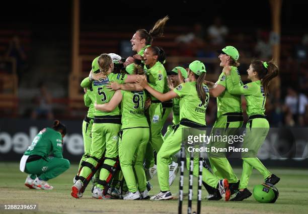 The Thunder celebrate victory during the Women's Big Bash League Final between the Melbourne Stars and the Sydney Thunder at North Sydney Oval, on...