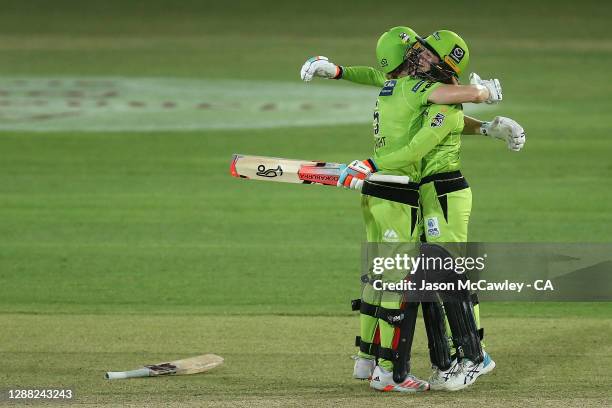 Heather Knight of the Thunder and Rachael Haynes of the Thunder celebrate victory during the Women's Big Bash League Final between the Melbourne...